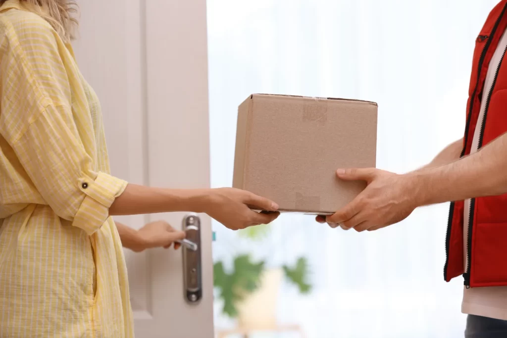package delivery to woman at her front door utc